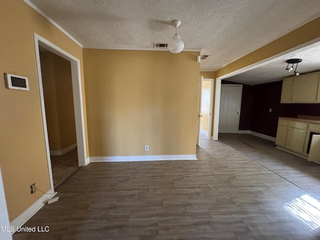 unfurnished dining area with a textured ceiling and hardwood / wood-style flooring