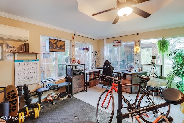 interior space featuring plenty of natural light, ceiling fan, crown molding, and a wall mounted AC