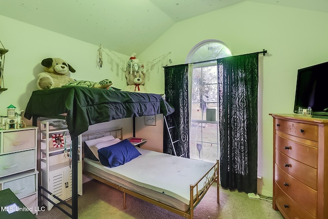 carpeted bedroom with lofted ceiling