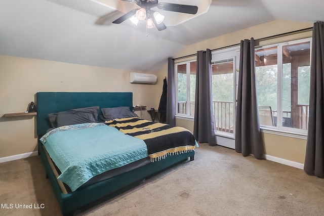 bedroom featuring an AC wall unit, multiple windows, ceiling fan, and vaulted ceiling