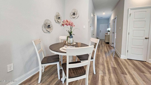 dining room featuring wood-type flooring