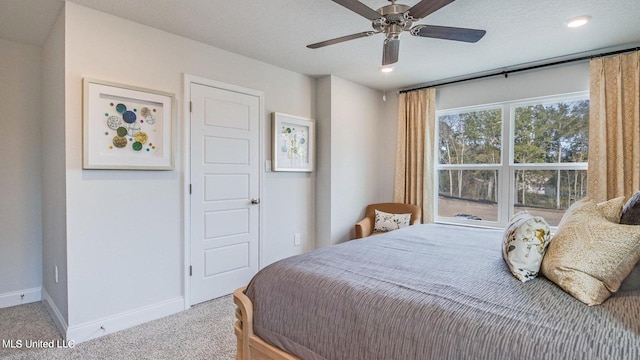 carpeted bedroom with ceiling fan