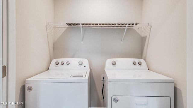 laundry area featuring washing machine and dryer