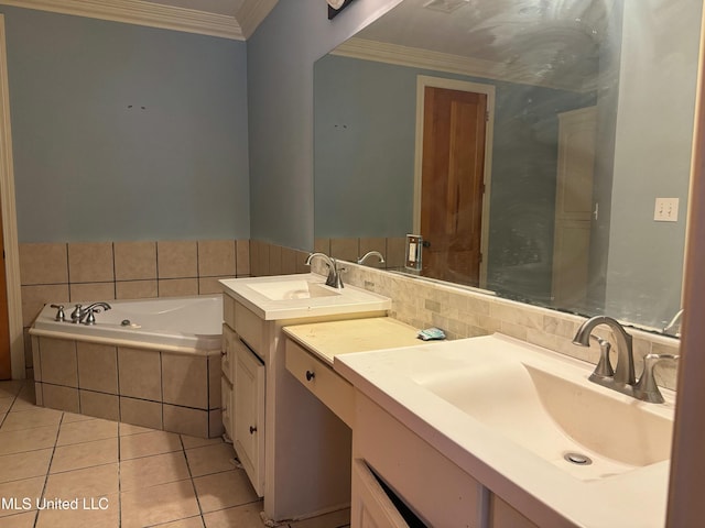 bathroom with vanity, tile patterned floors, crown molding, and tiled tub