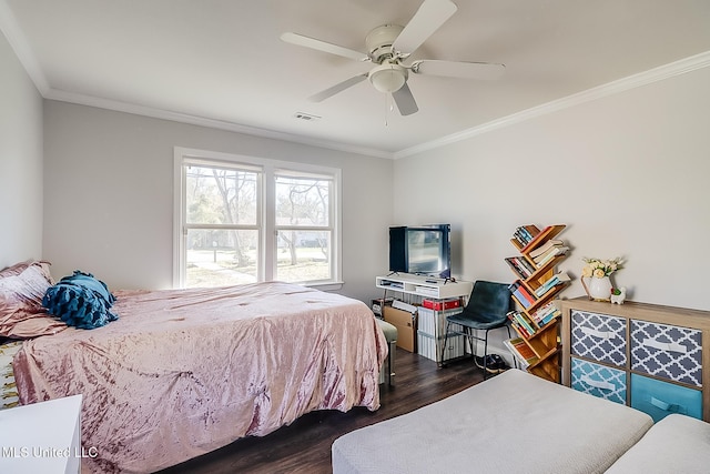 bedroom with ornamental molding, ceiling fan, and dark hardwood / wood-style floors