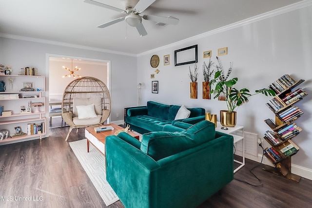 living room featuring crown molding, ceiling fan with notable chandelier, and hardwood / wood-style flooring