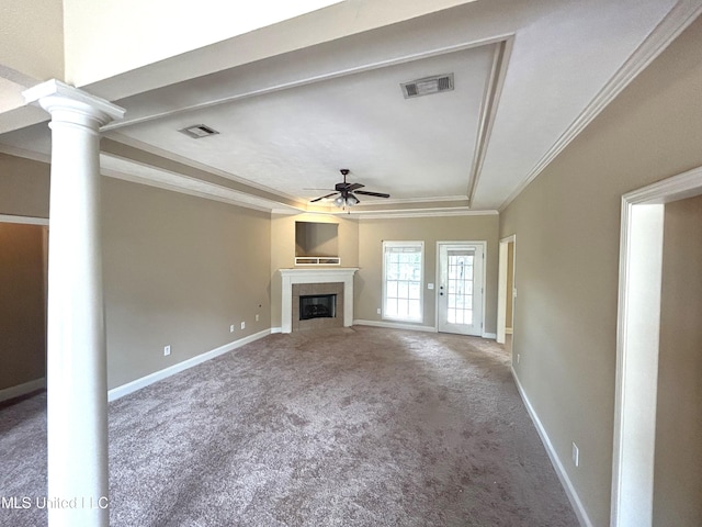 unfurnished living room with crown molding, carpet, a fireplace, and ceiling fan