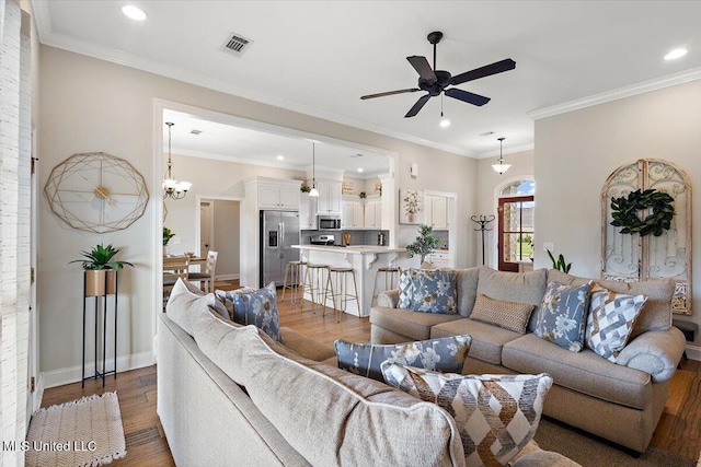 142 Western Ridge Cir, Canton, MS 39046 - living room with ceiling fan, wood finished floors, recessed lighting, ornamental molding, and baseboards