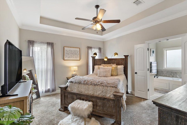 142 Western Ridge Cir, Canton, MS 39046 - bedroom with light colored carpet, a tray ceiling, crown molding, baseboards, and connected bathroom