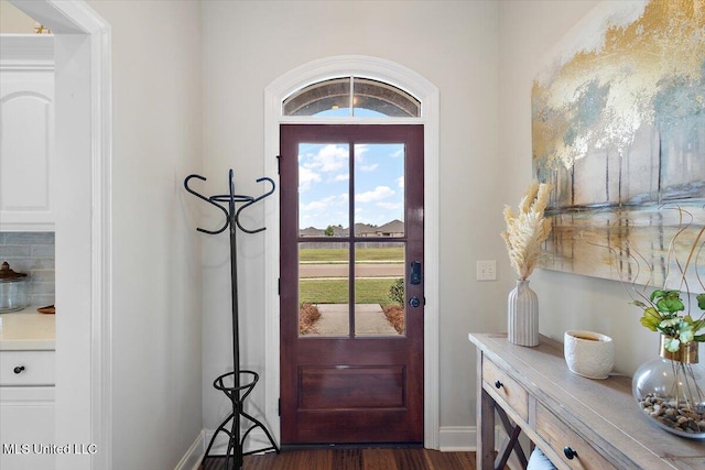 142 Western Ridge Cir, Canton, MS 39046 - entryway with dark wood-type flooring and baseboards
