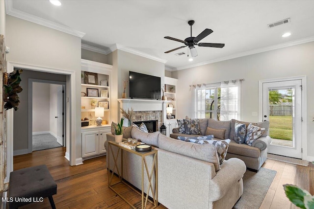 142 Western Ridge Cir, Canton, MS 39046 - living area with a fireplace, ceiling fan, wood finished floors, ornamental molding, and recessed lighting