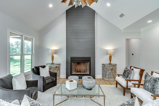 106 Horseshoe Ln, Flora, MS 39071 - living room featuring light wood-style floors, a large fireplace, high vaulted ceiling, baseboards, and recessed lighting