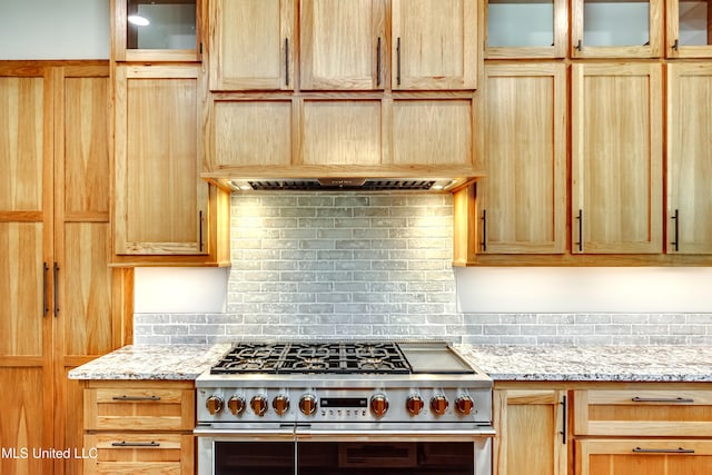 106 Horseshoe Ln, Flora, MS 39071 - kitchen featuring double oven range, decorative backsplash, glass insert cabinets, and light stone counters