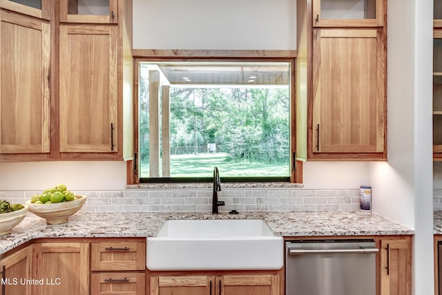 106 Horseshoe Ln, Flora, MS 39071 - kitchen featuring a sink, dishwasher, backsplash, and light stone countertops