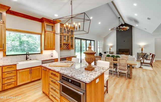 106 Horseshoe Ln, Flora, MS 39071 - kitchen with a sink, beam ceiling, healthy amount of natural light, tasteful backsplash, and recessed lighting