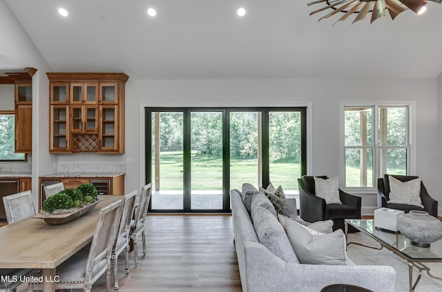 106 Horseshoe Ln, Flora, MS 39071 - living area with healthy amount of natural light, light wood-style flooring, vaulted ceiling, and recessed lighting
