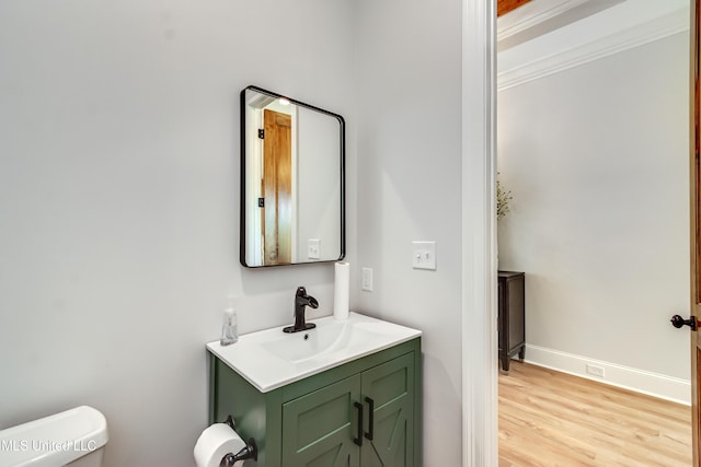106 Horseshoe Ln, Flora, MS 39071 - half bath with vanity, toilet, wood finished floors, and baseboards