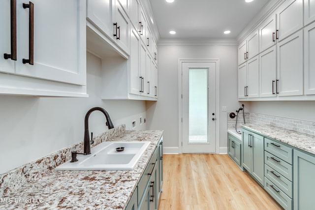 106 Horseshoe Ln, Flora, MS 39071 - kitchen with a sink, light wood-type flooring, recessed lighting, decorative backsplash, and ornamental molding