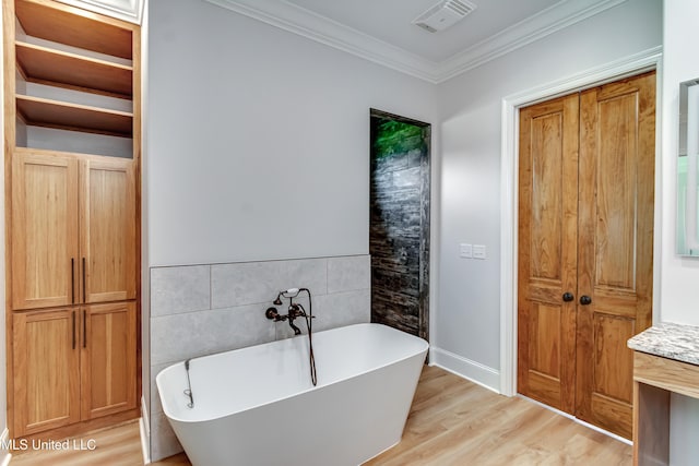 106 Horseshoe Ln, Flora, MS 39071 - full bathroom featuring a soaking tub, tile walls, ornamental molding, wood finished floors, and vanity