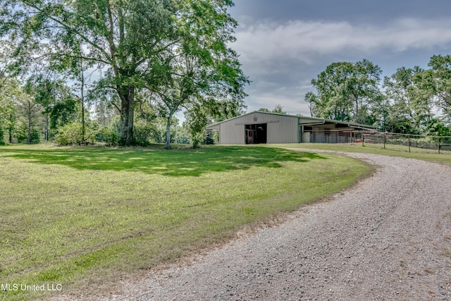 106 Horseshoe Ln, Flora, MS 39071 - view of yard with an outbuilding, gravel driveway, and a garage