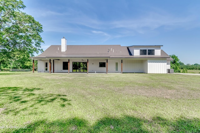 106 Horseshoe Ln, Flora, MS 39071 - rear view of house featuring a ceiling fan, a patio, central air condition unit, and a lawn