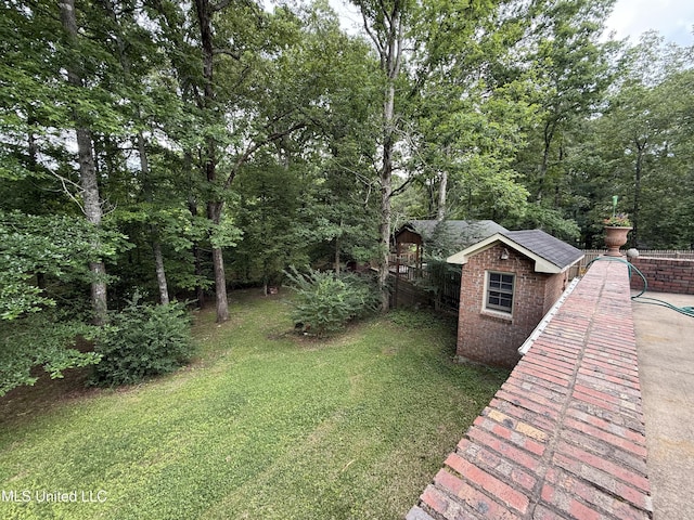 1331 Northwood Cir, Carthage, MS 39051 - view of green lawn with a shed