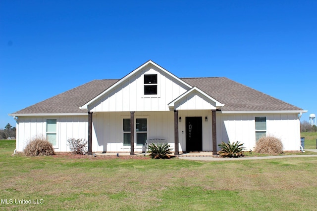 modern farmhouse with covered porch, board and batten siding, and a front yard