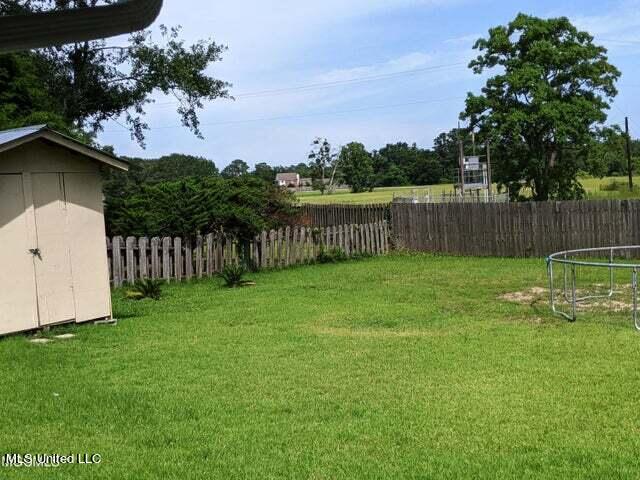 view of yard featuring a trampoline