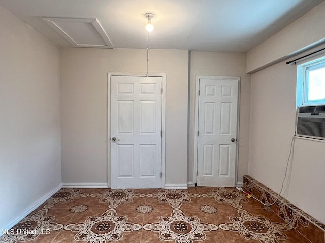 unfurnished bedroom with tile patterned floors and a closet