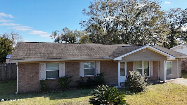 ranch-style home featuring a front yard