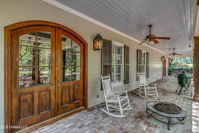 338 Hillview Dr, Ridgeland, MS 39157 - view of patio / terrace featuring ceiling fan, an outdoor fire pit, and french doors