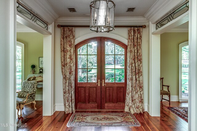 338 Hillview Dr, Ridgeland, MS 39157 - foyer entrance with french doors, crown molding, a chandelier, and wood-type flooring
