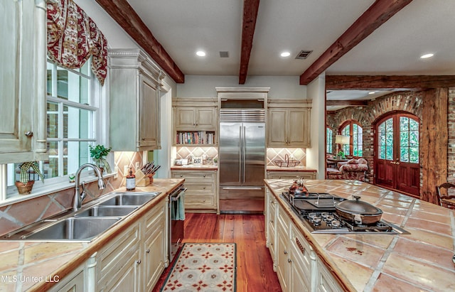 338 Hillview Dr, Ridgeland, MS 39157 - kitchen with tile counters, decorative backsplash, sink, and stainless steel appliances