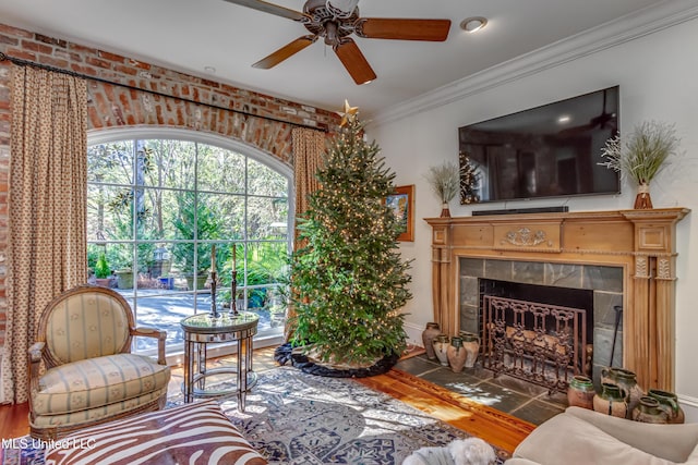 338 Hillview Dr, Ridgeland, MS 39157 - living room with hardwood / wood-style flooring, ceiling fan, ornamental molding, and a tiled fireplace
