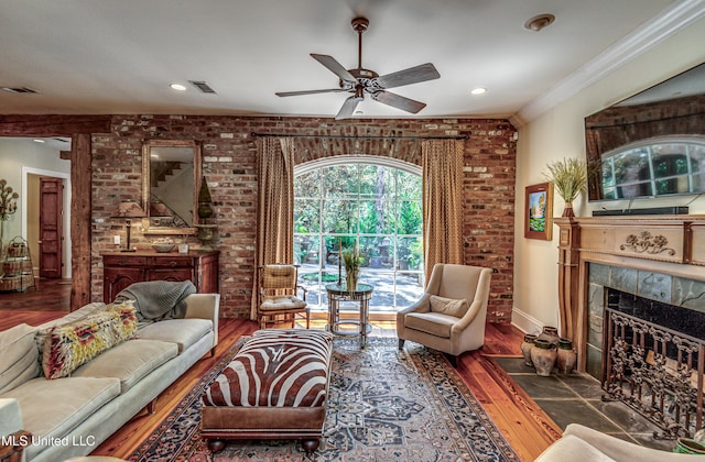 338 Hillview Dr, Ridgeland, MS 39157 - living room with dark wood-type flooring, a fireplace, brick wall, and crown molding