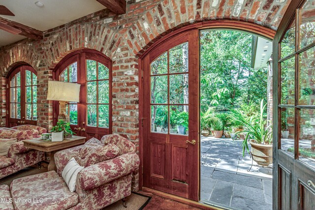 338 Hillview Dr, Ridgeland, MS 39157 - doorway with brick wall, french doors, and beamed ceiling