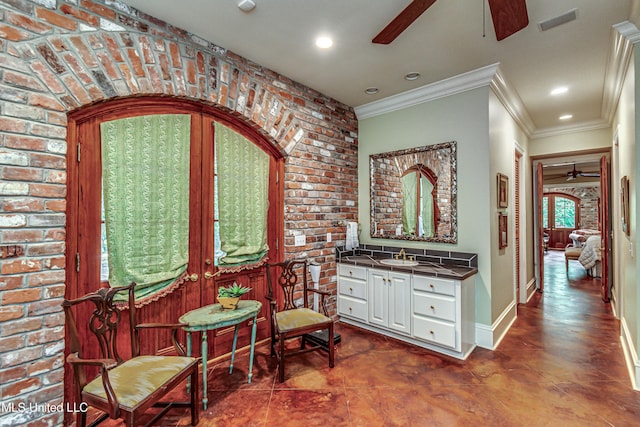 338 Hillview Dr, Ridgeland, MS 39157 - sitting room featuring sink, brick wall, and ornamental molding