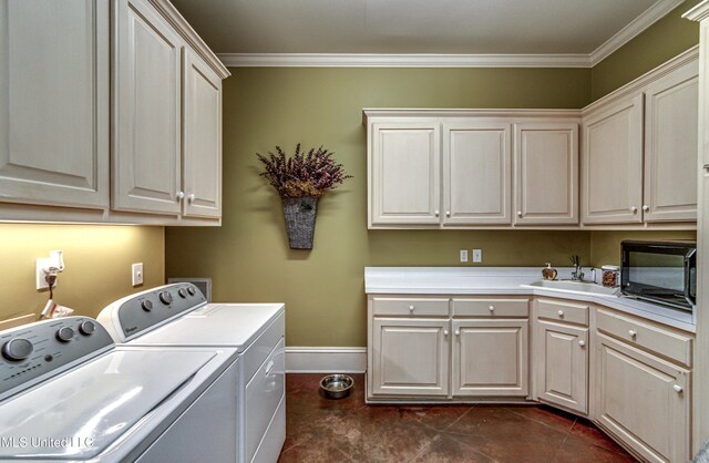 338 Hillview Dr, Ridgeland, MS 39157 - washroom with cabinets, crown molding, sink, and washing machine and clothes dryer
