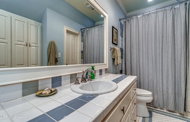 338 Hillview Dr, Ridgeland, MS 39157 - bathroom with toilet, vanity, tile patterned floors, and ornamental molding