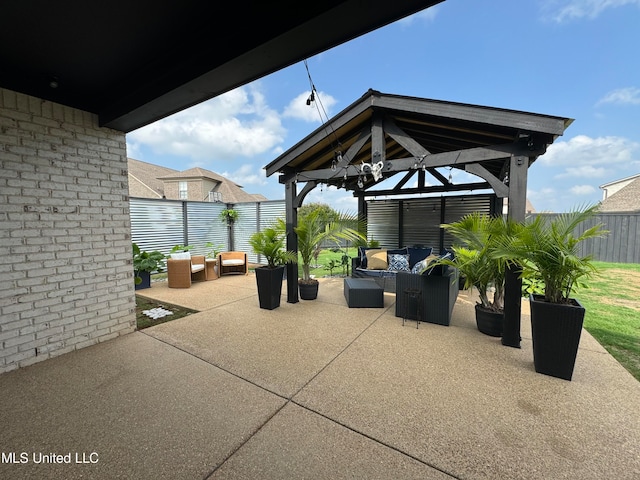 view of patio featuring a gazebo and outdoor lounge area