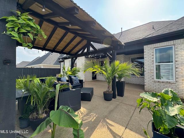 view of patio with a gazebo and an outdoor living space