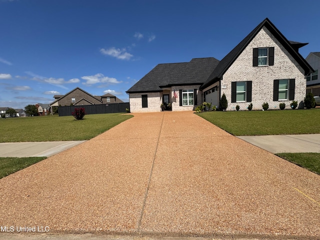 view of front of property with a front lawn