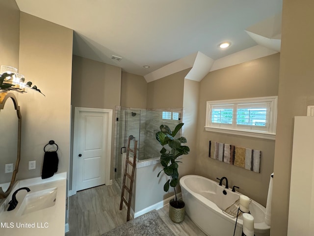 bathroom featuring vanity and plus walk in shower