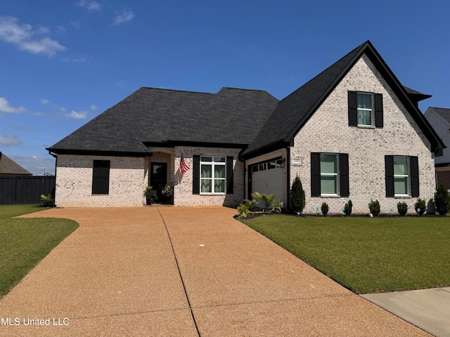 view of front facade featuring a front yard and a garage