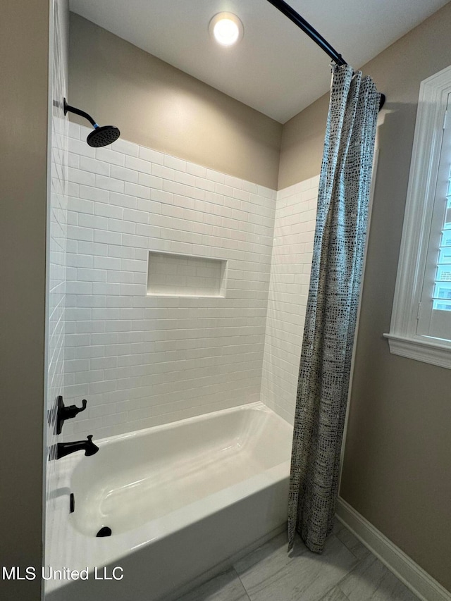 bathroom featuring shower / tub combo