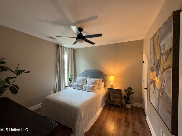 bedroom featuring dark wood-type flooring and ceiling fan