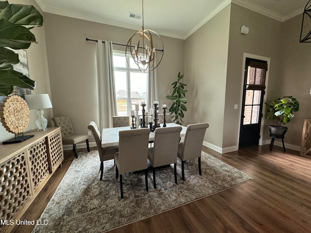 dining space with ornamental molding, a notable chandelier, and dark hardwood / wood-style flooring