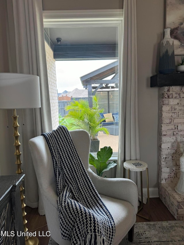 sitting room featuring dark wood-type flooring