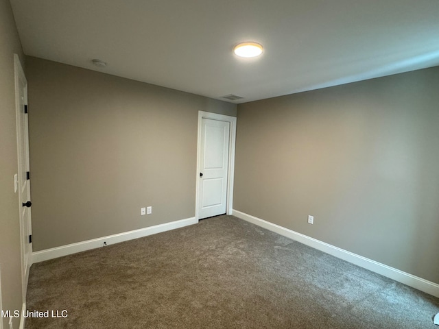 empty room with carpet flooring