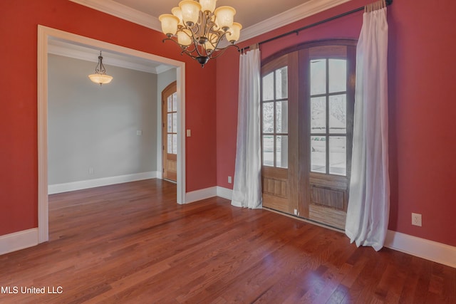 interior space featuring crown molding, an inviting chandelier, and hardwood / wood-style flooring